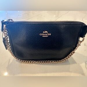 Vintage Coach wristlet clutch. Black pebbled leather with gold chain.